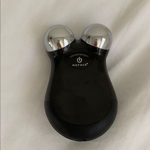 Nuface mini facial device. With a charger